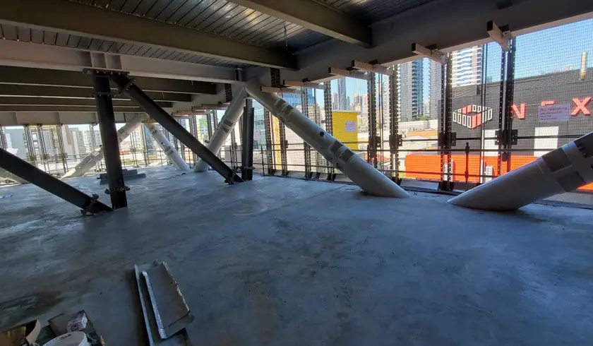 Diagonal exoskeleton members crossing an open floor level at Jubilee Place