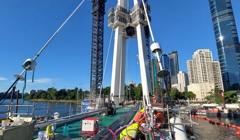 Cable stays being installed at dawn
