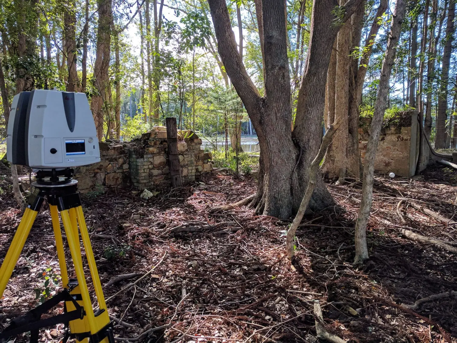 Laser scanner set up beside the stone ruins of the Moray-Fields settlement in North Harbour Heritage Park
