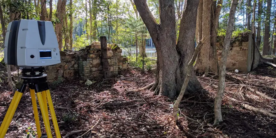Laser scanner set up beside the stone ruins of the Moray-Fields settlement in North Harbour Heritage Park