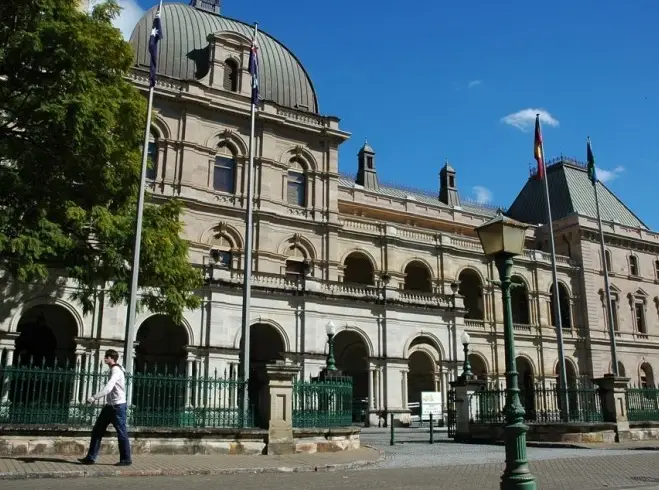 The sandstone facade and domed roof of Old Parliament House, Brisbane