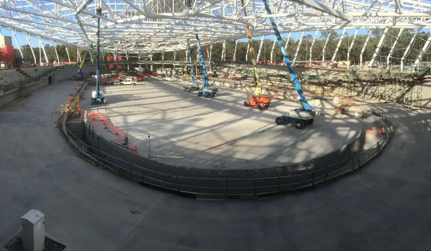 Panorama of the velodrome track base under construction beneath the steel roof