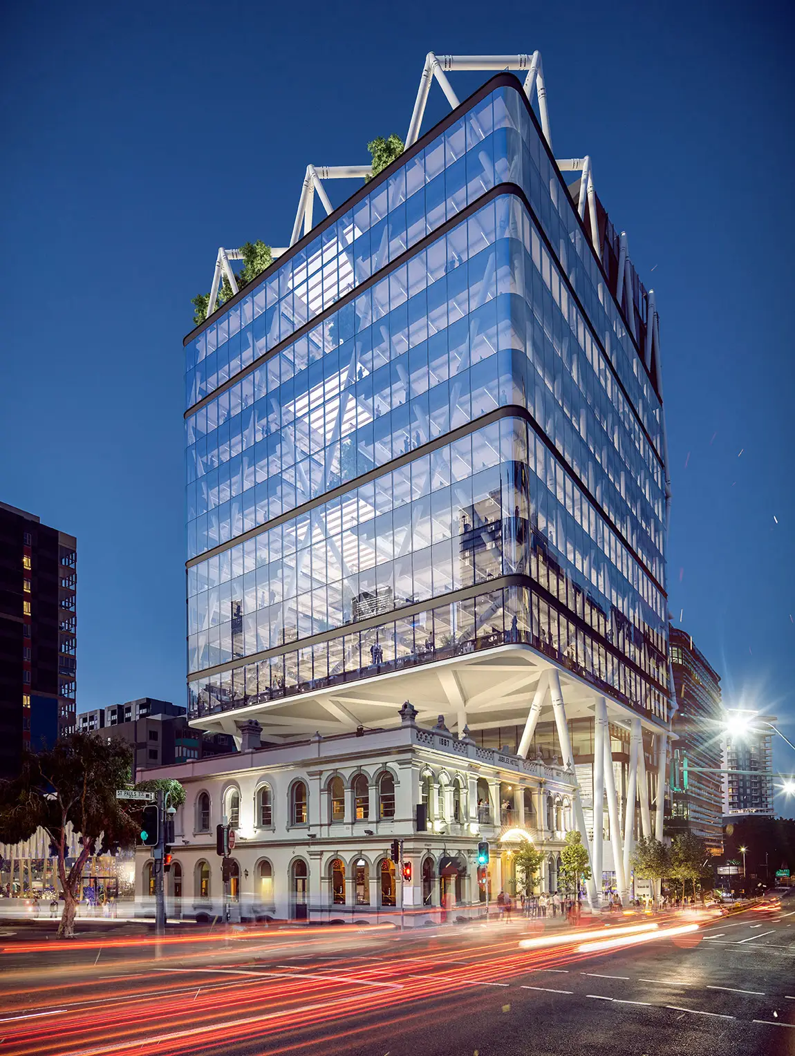 Render of Jubilee Place at night, its glass tower and white steel exoskeleton cantilevered over the heritage Jubilee Hotel